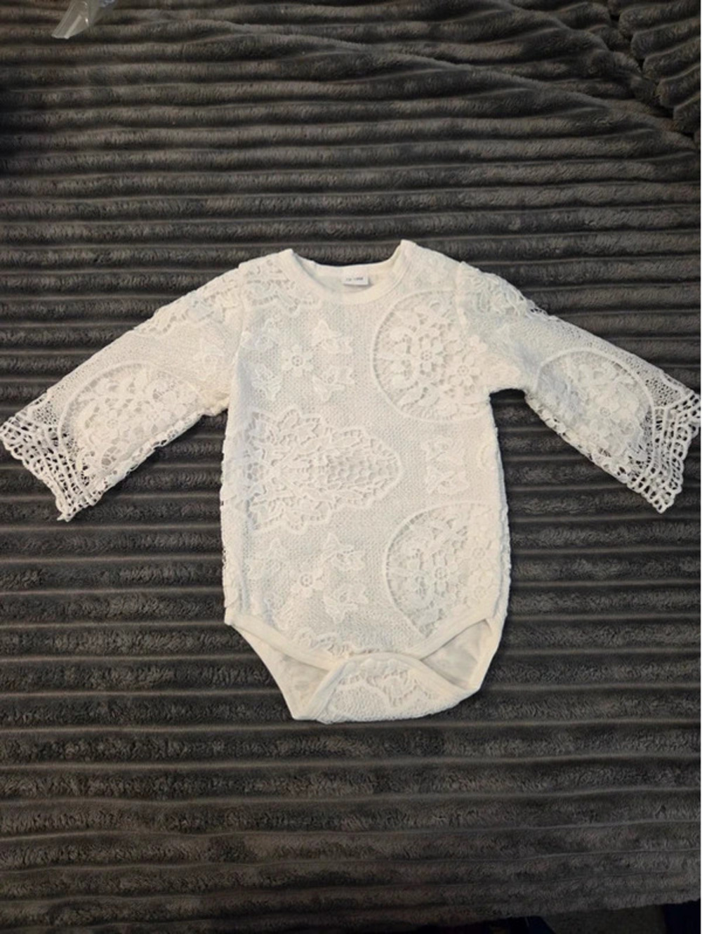 White lace baby bodysuit